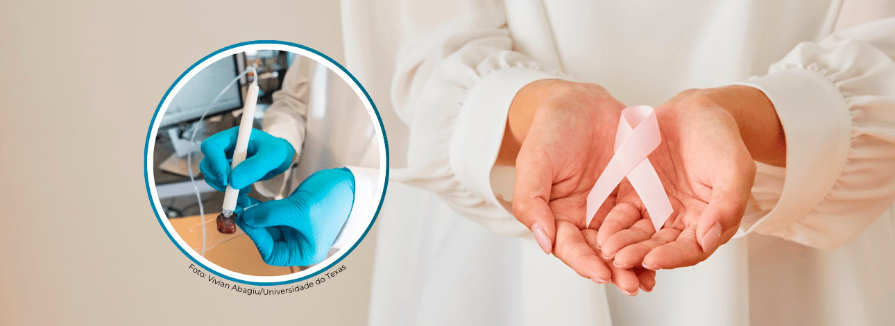 Mulher segurando uma fita rosa, representando câncer