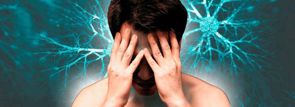 Homem com as mãos na cabeça sofrendo de depressão