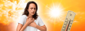 Mulher sofrendo com problemas respiratórios no calor